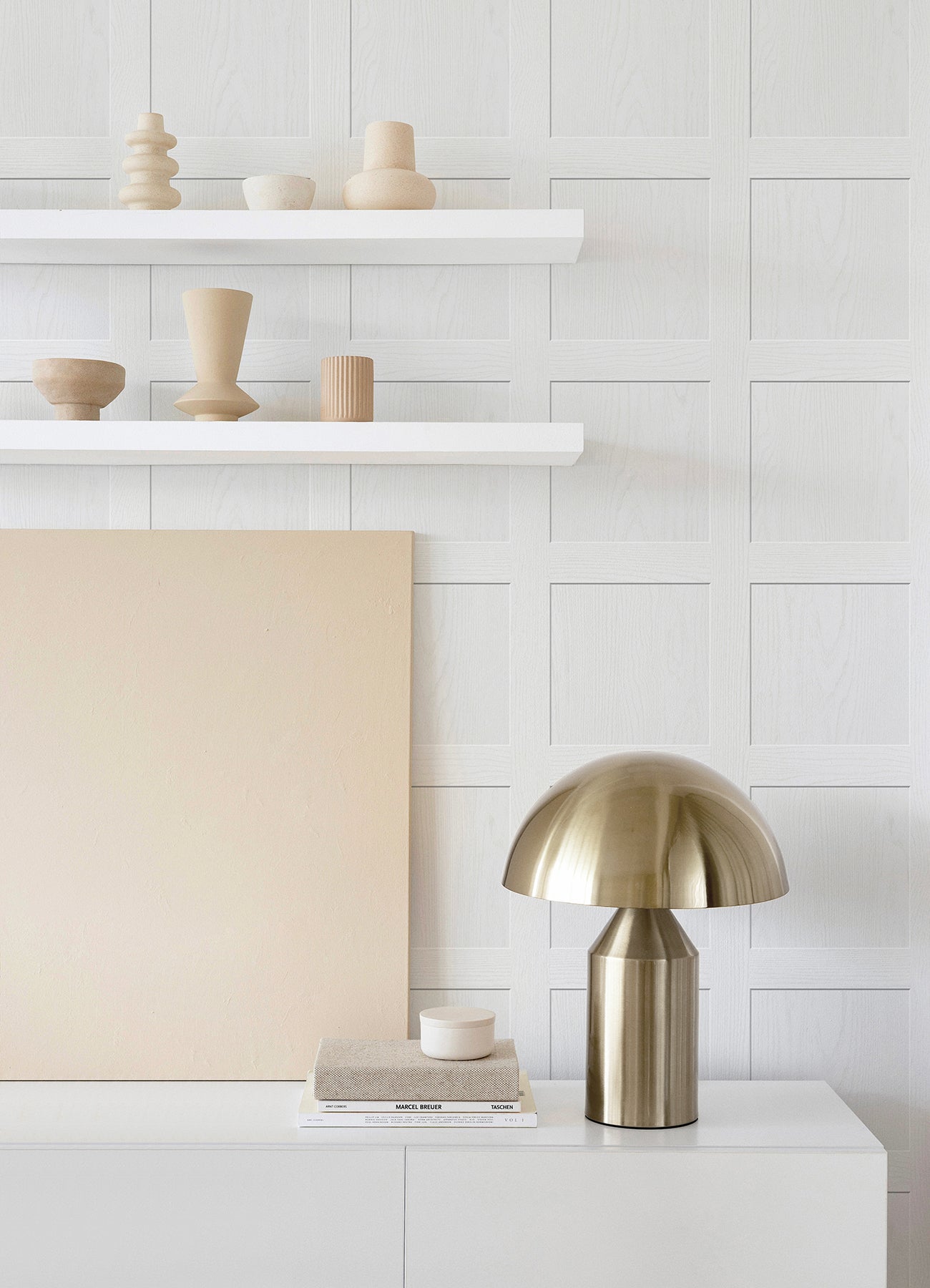 A chart titled “How Much Ashley Stark Home Chase Wood Peel and Stick Wallpaper?” by WallPops displays a grid for estimating the number of wallpaper rolls needed based on wall length 6–46 ft and ceiling height 8–12 ft, with small diagrams showing how to measure each. Each roll covers 30.75 sq ft.