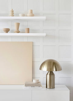 A chart titled “How Much Ashley Stark Home Chase Wood Peel and Stick Wallpaper?” by WallPops displays a grid for estimating the number of wallpaper rolls needed based on wall length 6–46 ft and ceiling height 8–12 ft, with small diagrams showing how to measure each. Each roll covers 30.75 sq ft.