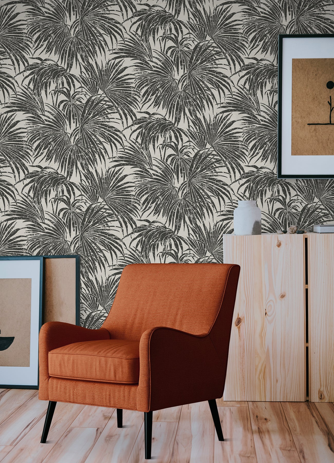 A dense, black and white grunge-style illustration of overlapping cassava palm leaves fills the image, with a light background and distressed textures that give a vintage, weathered appearance—evoking the timeless look of WallPops’ Egypt Sherrod Cassava Palm Peel and Stick Wallpaper. No blank spaces are visible in the pattern.