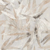 A person peels back a corner of the WallPops Egypt Sherrod Bali Bamboo Peel and Stick Wallpaper, which features abstract leaf designs in beige, gray, and blush tones. The wallpaper is displayed on a wooden surface, and the person wears a wedding ring and another ring on their left hand’s ring finger.