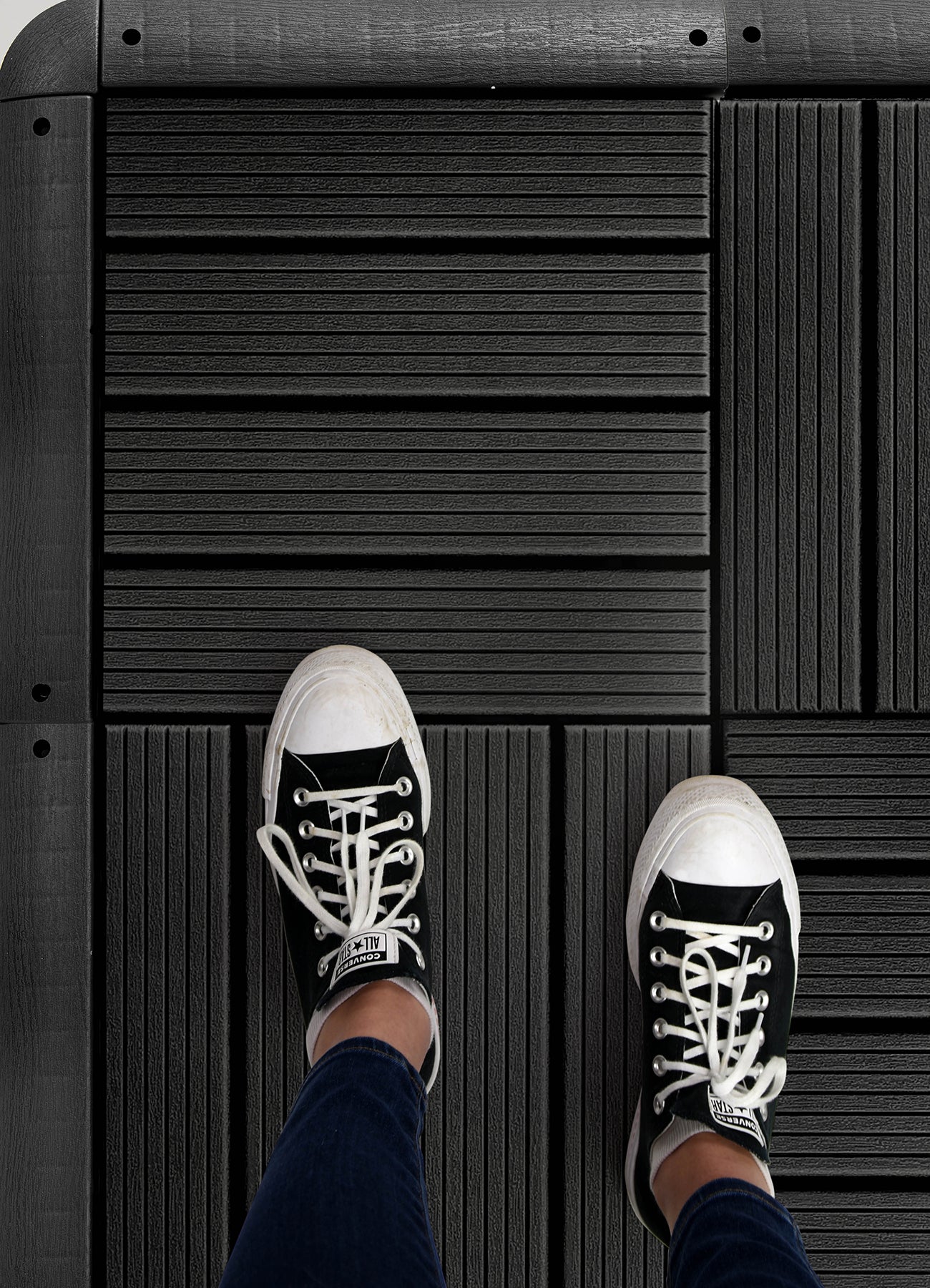 Corner Piece Decking Tiles in a room setting