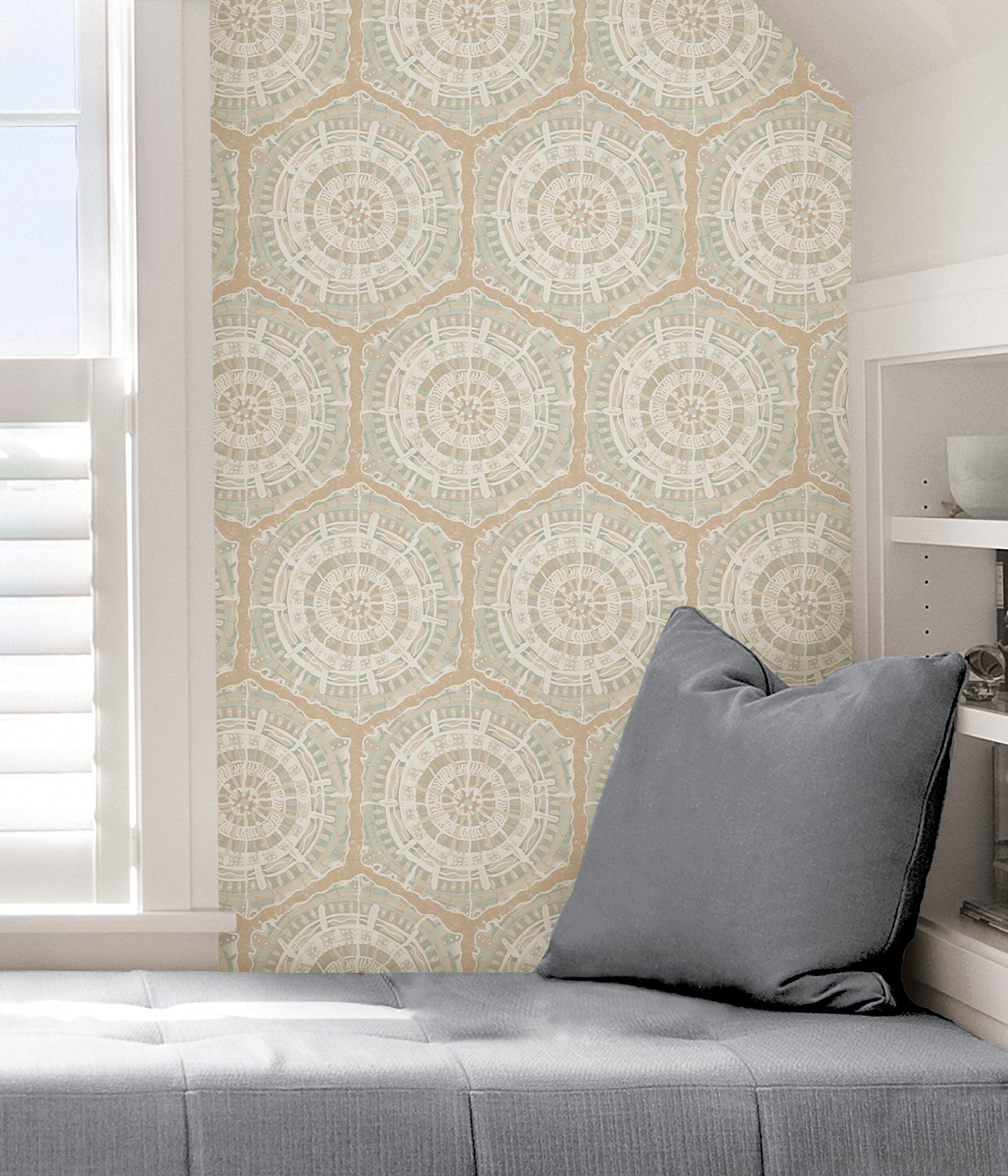 A modern dining room featuring a wooden table, eight black chairs, white built-in cabinets, and blue LiLi WhittWhitt Harmony Peel and Stick Wallpaper by WallPops. Above a white fireplace hangs a colorful abstract portrait. The space is accented with decorative pottery, candles, and a single-stem vase.