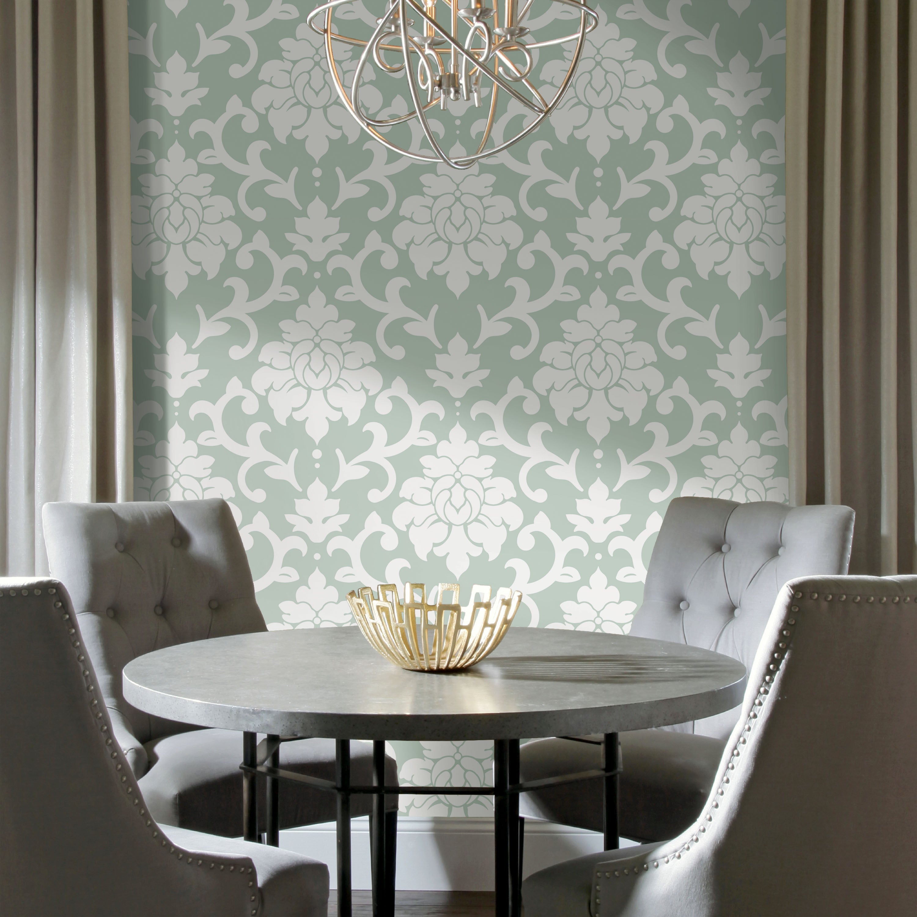 A roll of WallPops Damask Peel & Stick Wallpaper features a pale green background adorned with large, ornate white floral patterns. This removable wallpaper measures 16.5 feet 5.03 meters in length and 20.5 inches 52.07 centimeters in width, making it an elegant choice for any space. Experience both convenience and style with this timeless WallPops design.