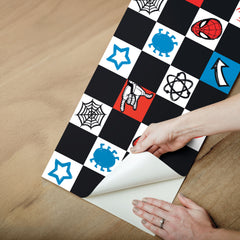 Spider-Man Checker Borders by WallPops features a dynamic checkerboard pattern with Spider-Man heads, red spiders, blue virus icons, comic-style arrows, white stars, web-shooting hands, black atom symbols, and webs across bold black, white, blue, and red squares. Inspired by rustic elements and distressed barn wood textures for enhanced character and style, this eye-catching peel-and-stick border brings a pop-art vibe to any space.