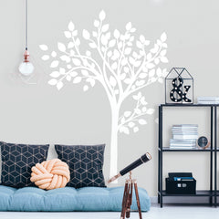 Featuring an illustration of three stylized tree branches with leaves—scattered and overlapping on a white background—Simple Tree Peel and Stick Giant Wall Decals by WallPops showcases a minimalistic design. Bold, clean white lines and shapes are used to depict the branches and leaves, resulting in an intricate, natural pattern that beautifully complements rustic décor like distressed barn wood or fits seamlessly with modern wall decal styles.