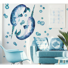 Bring an artistic touch to your space with the Cat Coquillette Narwhal Giant Peel and Stick Wall Decals by WallPops. This charming set features two watercolor narwhals with blue speckles and long spiral tusks facing each other. Dimension arrows highlight their size—standing 44.59 inches 1.1 m tall and 29.24 inches 74.27 cm wide—while four key points are marked with numbered black circles for easy placement. Their gentle hues make these giant decals a delightful, hassle-free accent to any room.