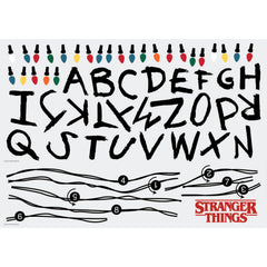 The WallPops Netflix Stranger Things Christmas Lights Peel And Stick Giant Wall Decals With Alphabet features a hand-drawn alphabet arranged in three rows, each row displayed beneath a line of colorful Christmas lights and accented with circled numbers 1–8 along the lines. This rustic design, measuring 27.43 69.6 cm tall by 46.04 1.16 m wide, boasts a light gray background reminiscent of distressed barn wood for added character.