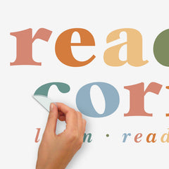 Create an inviting classroom reading nook with the Reading Corner Multicolor Wall Quote Decals by WallPops. Featuring vibrant Reading Corner text above the inspiring words learn · read · discover, these easy-to-apply peel and stick decals are perfect for your space. The set includes a vertical arrow 36.47 cm and a horizontal arrow 90.27 cm, all on a crisp white background, making it simple to mark your reading corner in style.