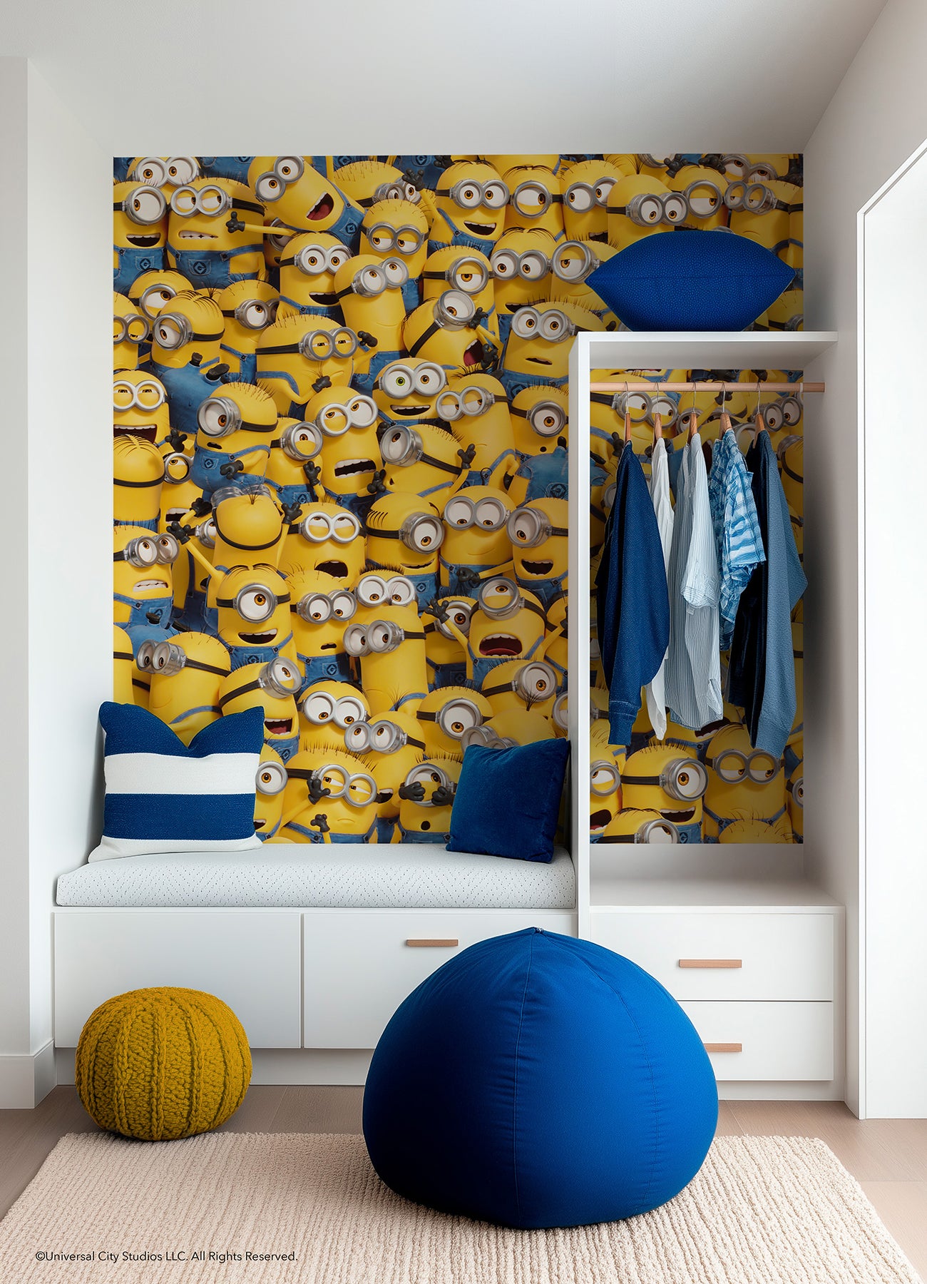 A lively scene from the Universal Studios Minions One in a Minion Peel and Stick Mural by WallPops shows a crowd of small yellow Minions—complete with goggles, blue overalls, and unique expressions—gathered closely together. Some are grinning, others appear surprised or are calling out, all adding to the playful and chaotic energy of this mural.