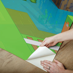 Transform any room with the Minecraft World Peel and Stick Wall Mural by WallPops. Divided into 7 labeled panels, this colorful mural features iconic Minecraft scenery—mountains, rivers, trees, rails, animals, and adventurous blocky characters set beneath a bright blue sky. Measuring 6 feet high by 10.5 feet wide with each panel 18 inches wide, this easy-to-install peel and stick mural is the perfect bold Minecraft décor upgrade for your space.
