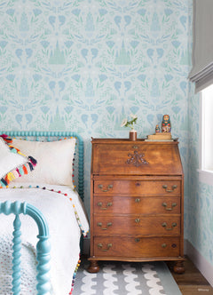 WallPops Frozen II Frozen Castle Damask Peel and Stick Wallpaper features pastel pink and lavender castle motifs with floral patterns, stylized flowers, leaves, hearts, and face profiles. Removable. Dimensions: 18 ft x 20.5 in.