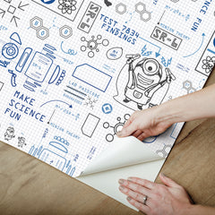 Featuring playful black line illustrations of Minions in lab coats, chemistry equipment, lab tools, QR codes, scientific diagrams, and phrases such as “MAKE SCIENCE FUN,” “TEST 7834 FINDINGS,” “SR-6,” and “LAB PASSCODE: BANANA3005” on a patterned white background with subtle watercolor stripe effects throughout. The Universal Studios Minions Science In Progress Peel and Stick Wallpaper by WallPops is perfect for adding a fun, scientific touch to any space.