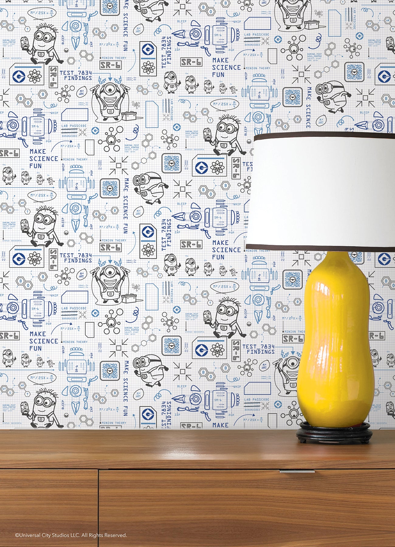 Featuring playful black line illustrations of Minions in lab coats, chemistry equipment, lab tools, QR codes, scientific diagrams, and phrases such as “MAKE SCIENCE FUN,” “TEST 7834 FINDINGS,” “SR-6,” and “LAB PASSCODE: BANANA3005” on a patterned white background with subtle watercolor stripe effects throughout. The Universal Studios Minions Science In Progress Peel and Stick Wallpaper by WallPops is perfect for adding a fun, scientific touch to any space.