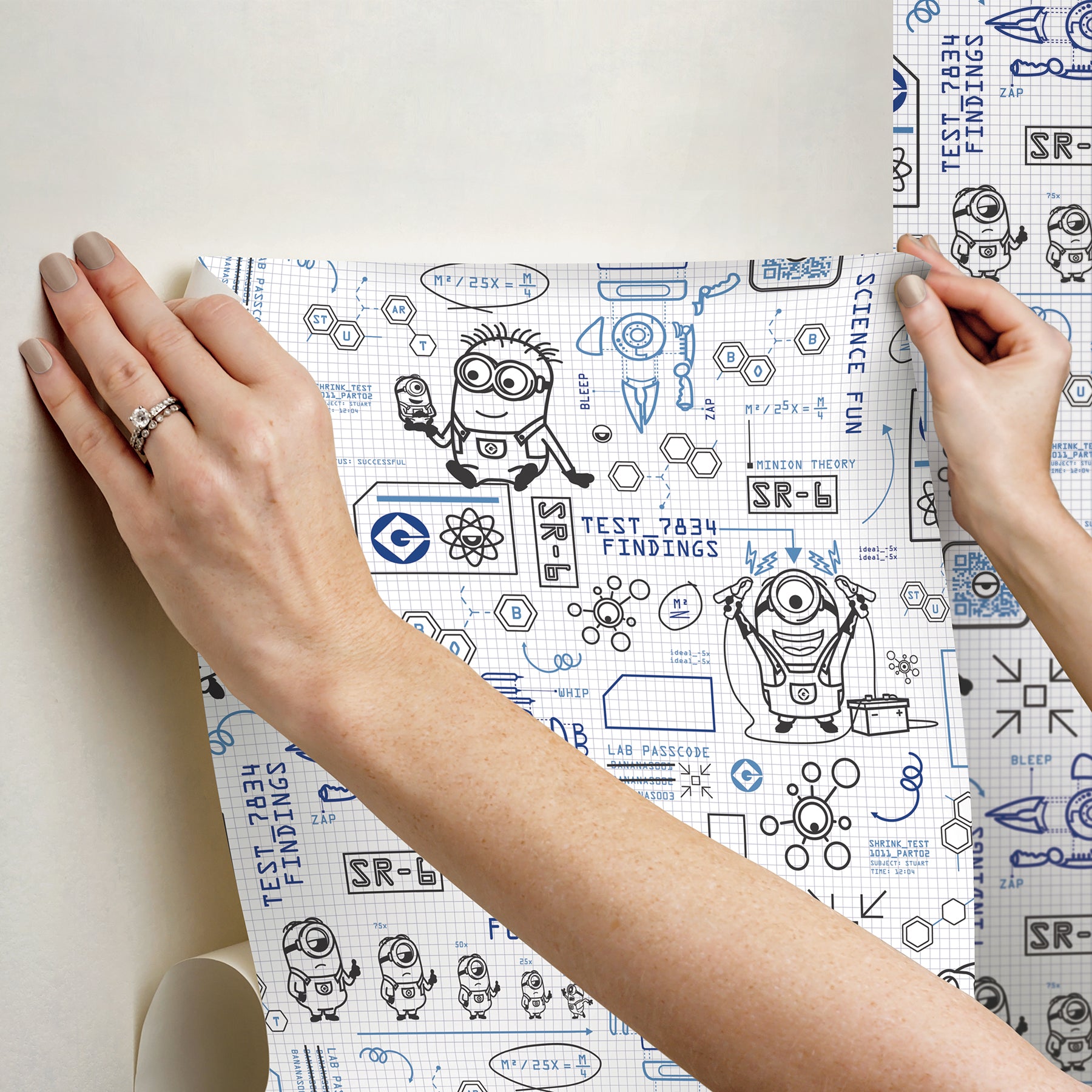 Featuring playful black line illustrations of Minions in lab coats, chemistry equipment, lab tools, QR codes, scientific diagrams, and phrases such as “MAKE SCIENCE FUN,” “TEST 7834 FINDINGS,” “SR-6,” and “LAB PASSCODE: BANANA3005” on a patterned white background with subtle watercolor stripe effects throughout. The Universal Studios Minions Science In Progress Peel and Stick Wallpaper by WallPops is perfect for adding a fun, scientific touch to any space.