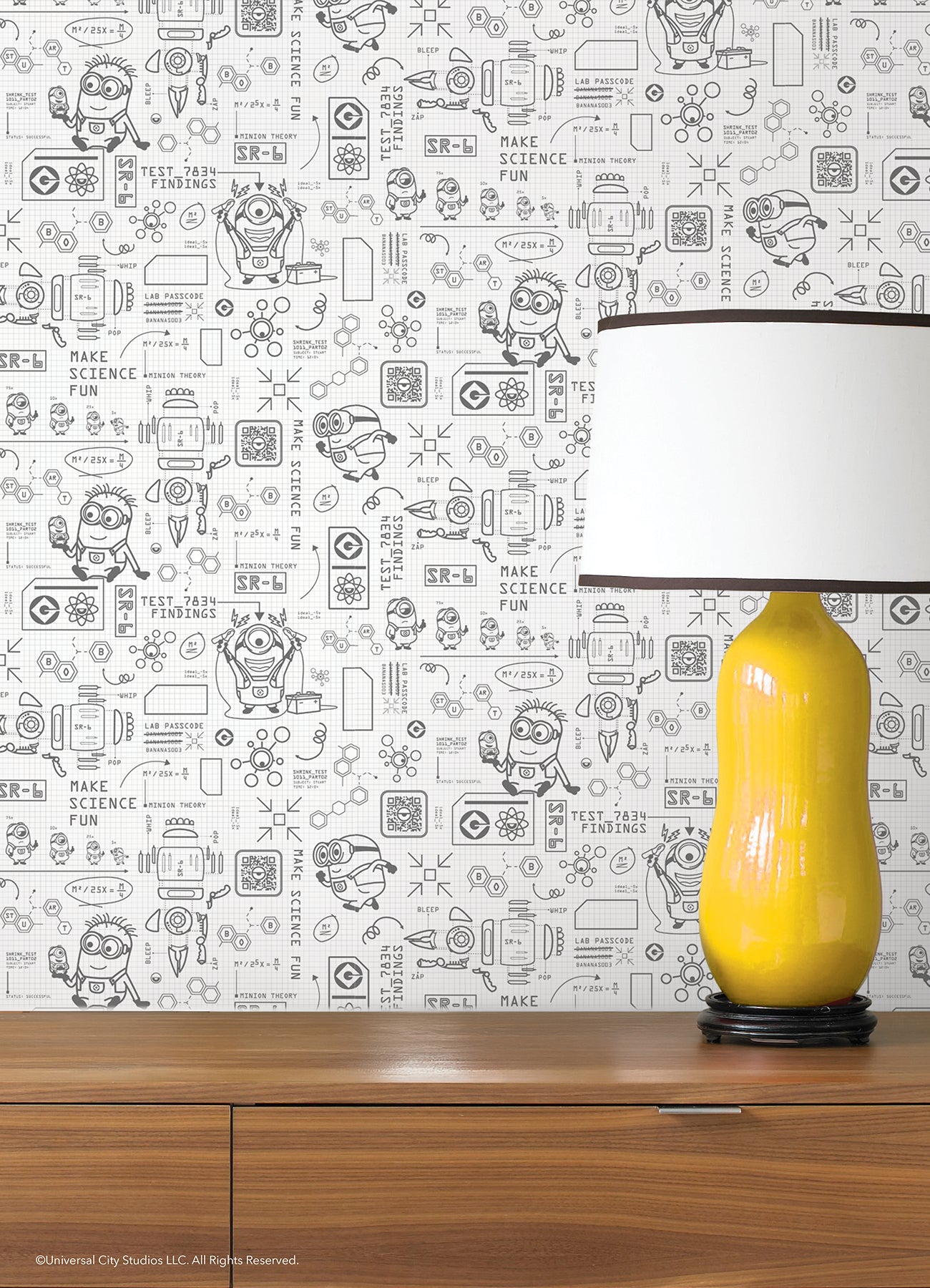 Featuring playful black line illustrations of Minions in lab coats, chemistry equipment, lab tools, QR codes, scientific diagrams, and phrases such as “MAKE SCIENCE FUN,” “TEST 7834 FINDINGS,” “SR-6,” and “LAB PASSCODE: BANANA3005” on a patterned white background with subtle watercolor stripe effects throughout. The Universal Studios Minions Science In Progress Peel and Stick Wallpaper by WallPops is perfect for adding a fun, scientific touch to any space.