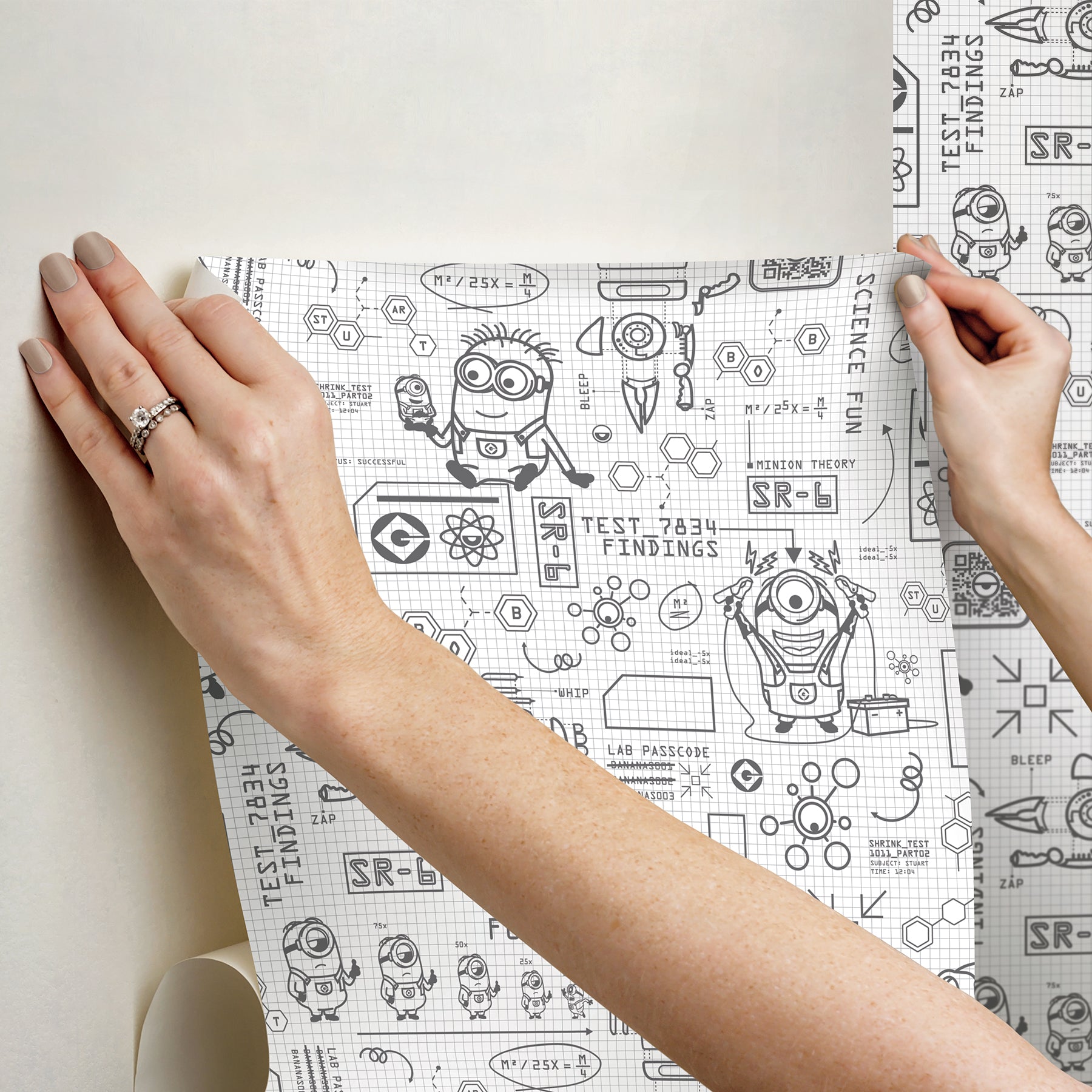 Featuring playful black line illustrations of Minions in lab coats, chemistry equipment, lab tools, QR codes, scientific diagrams, and phrases such as “MAKE SCIENCE FUN,” “TEST 7834 FINDINGS,” “SR-6,” and “LAB PASSCODE: BANANA3005” on a patterned white background with subtle watercolor stripe effects throughout. The Universal Studios Minions Science In Progress Peel and Stick Wallpaper by WallPops is perfect for adding a fun, scientific touch to any space.