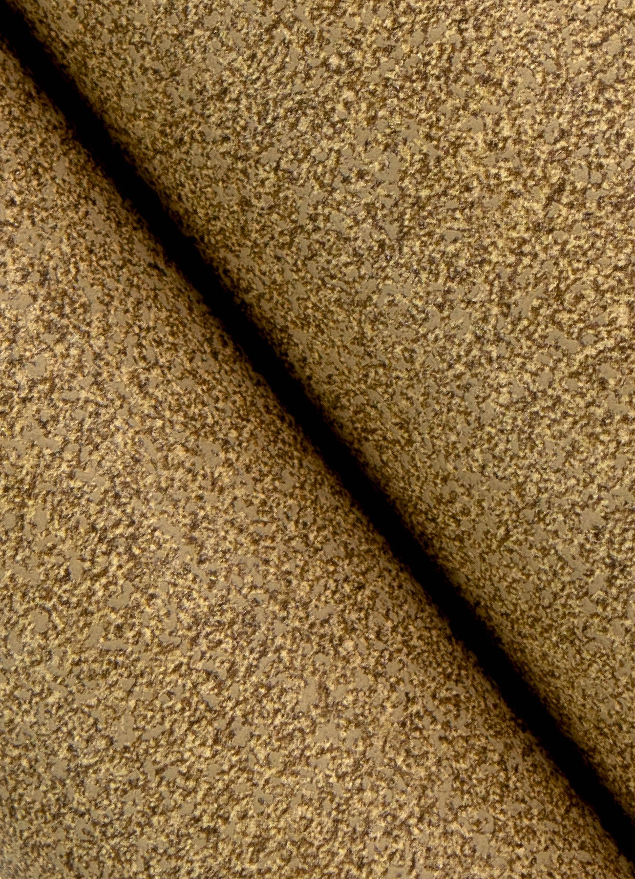 A close-up view of a cork board surface reveals a natural, subtly uneven texture composed of tiny light to medium brown granules pressed together. This organic look would beautifully complement WallPops’ RuPaul RuSuede Peel and Stick Wallpaper or pair seamlessly with other azure blue wallcoverings for easy and stylish customization. The surface is shown free from any objects, pins, or text.