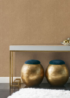 A close-up view of a cork board surface reveals a natural, subtly uneven texture composed of tiny light to medium brown granules pressed together. This organic look would beautifully complement WallPops’ RuPaul RuSuede Peel and Stick Wallpaper or pair seamlessly with other azure blue wallcoverings for easy and stylish customization. The surface is shown free from any objects, pins, or text.