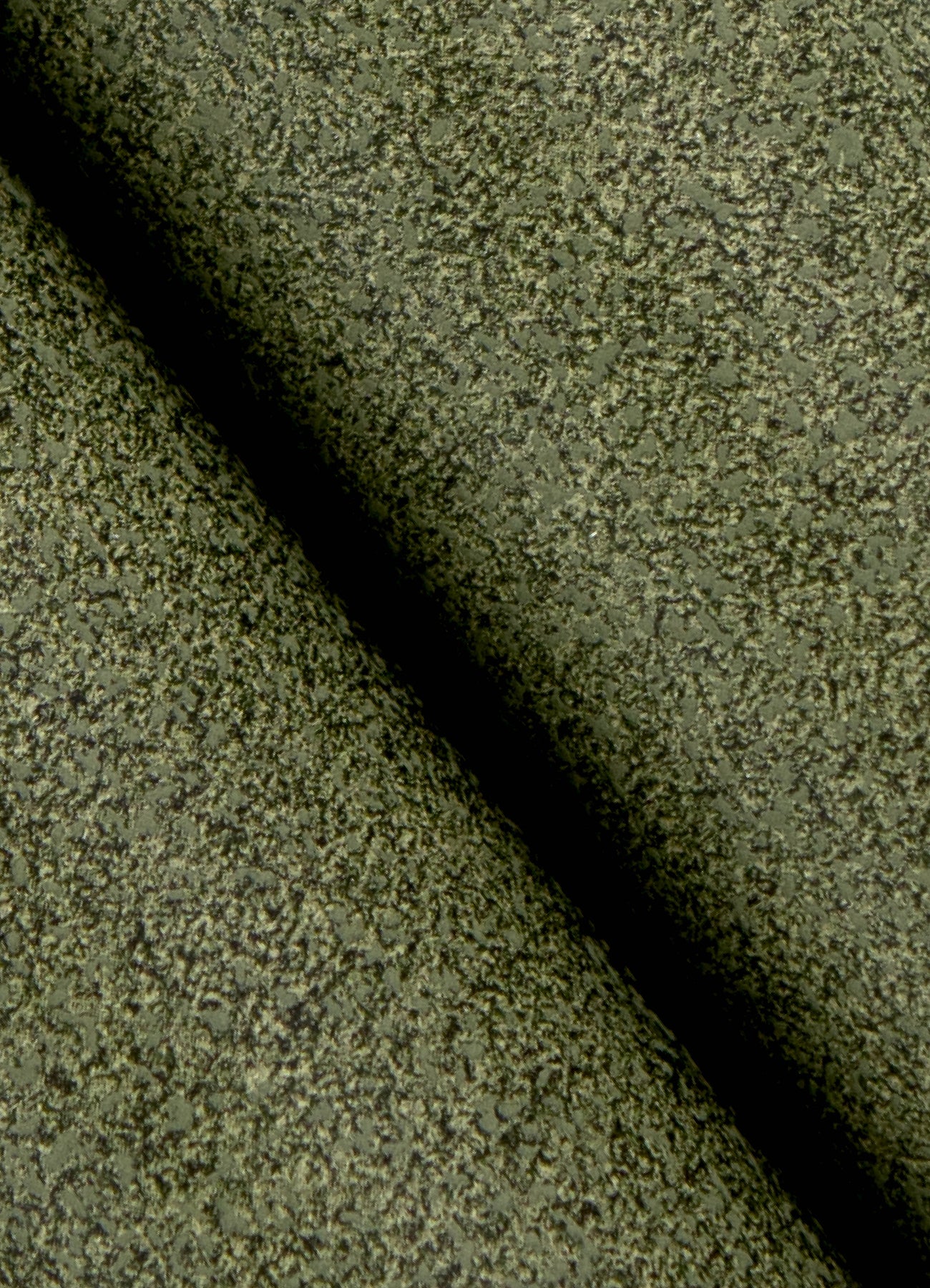 A close-up view of a cork board surface reveals a natural, subtly uneven texture composed of tiny light to medium brown granules pressed together. This organic look would beautifully complement WallPops’ RuPaul RuSuede Peel and Stick Wallpaper or pair seamlessly with other azure blue wallcoverings for easy and stylish customization. The surface is shown free from any objects, pins, or text.