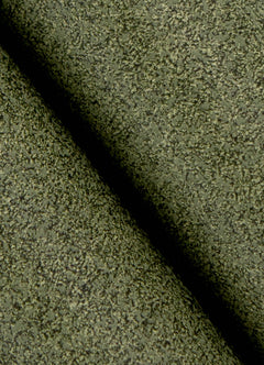 A close-up view of a cork board surface reveals a natural, subtly uneven texture composed of tiny light to medium brown granules pressed together. This organic look would beautifully complement WallPops’ RuPaul RuSuede Peel and Stick Wallpaper or pair seamlessly with other azure blue wallcoverings for easy and stylish customization. The surface is shown free from any objects, pins, or text.