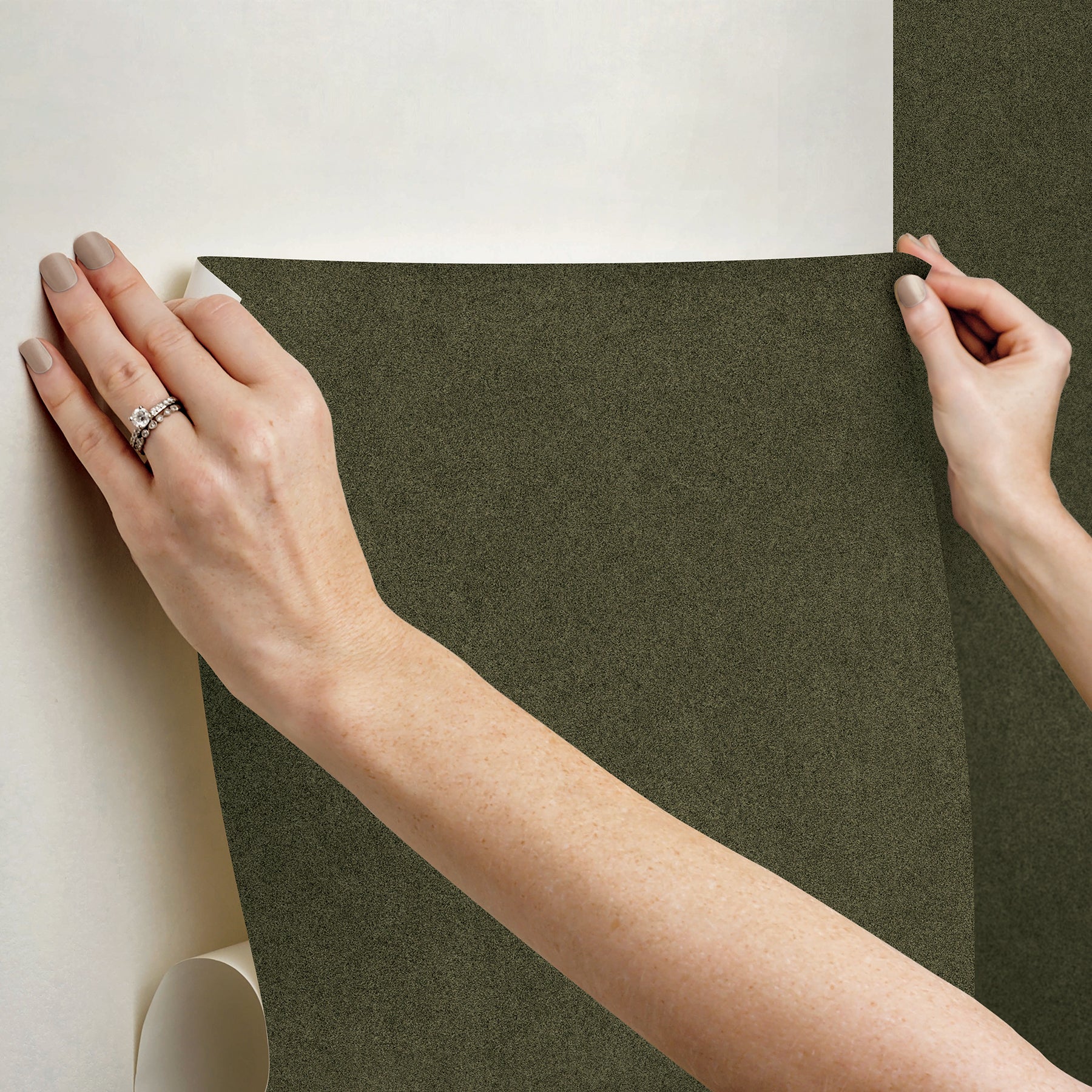 A close-up view of a cork board surface reveals a natural, subtly uneven texture composed of tiny light to medium brown granules pressed together. This organic look would beautifully complement WallPops’ RuPaul RuSuede Peel and Stick Wallpaper or pair seamlessly with other azure blue wallcoverings for easy and stylish customization. The surface is shown free from any objects, pins, or text.